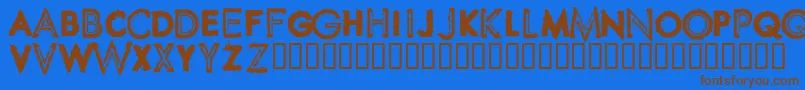 SpikeCrumbSwollen-Schriftart – Braune Schriften auf blauem Hintergrund