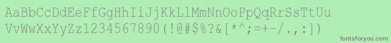 CourierNewCyr80n-fontti – harmaat kirjasimet vihreällä taustalla