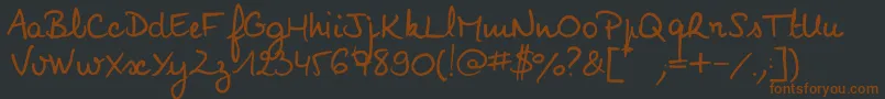 Fonte Noemiescript – fontes marrons em um fundo preto