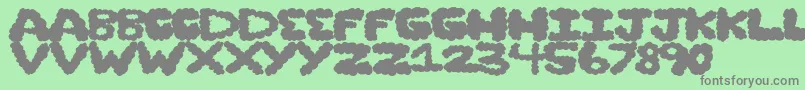 Cloudstorm Font – Gray Fonts on Green Background