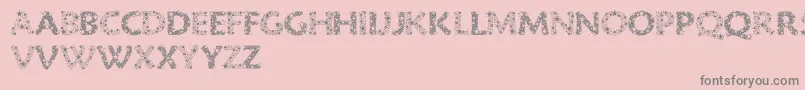 RazzleDazzle-fontti – harmaat kirjasimet vaaleanpunaisella taustalla