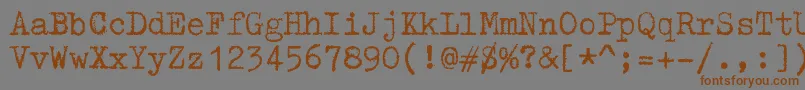 Czcionka ZaiTriumphtypewriter – brązowe czcionki na szarym tle