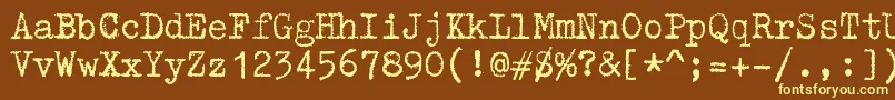 ZaiTriumphtypewriter-fontti – keltaiset fontit ruskealla taustalla
