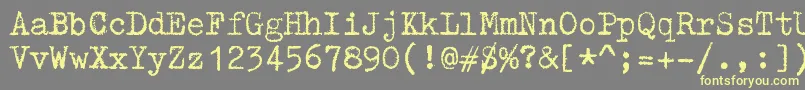 Шрифт ZaiTriumphtypewriter – жёлтые шрифты на сером фоне