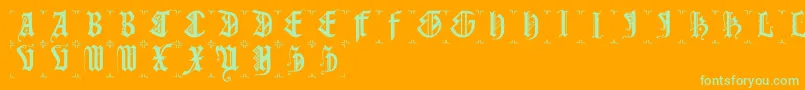 Gothiccapsb-Schriftart – Grüne Schriften auf orangefarbenem Hintergrund