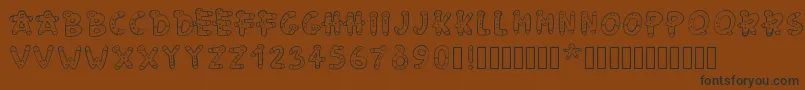 フォントPwgingerbread – 黒い文字が茶色の背景にあります