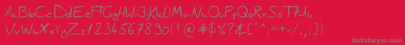 Fonte ScragesHandwrite – fontes cinzas em um fundo vermelho
