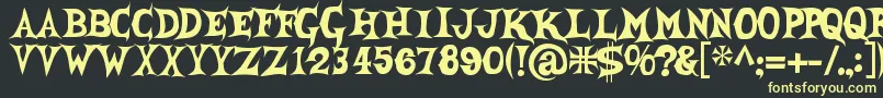 Shecreature Font – Yellow Fonts on Black Background