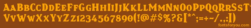 フォントBrasspsc – オレンジ色の文字が茶色の背景にあります。