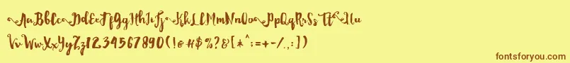 フォントDality – 茶色の文字が黄色の背景にあります。