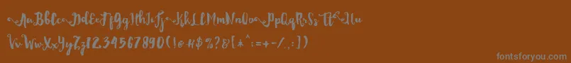 フォントDality – 茶色の背景に灰色の文字