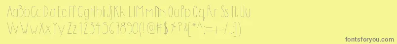 フォントDilemhandwritten – 黄色の背景に灰色の文字