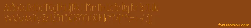Dilemhandwritten-fontti – oranssit fontit ruskealla taustalla