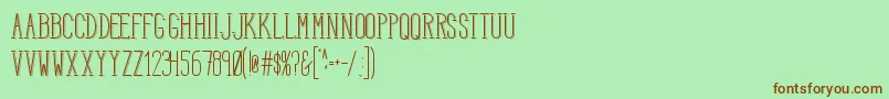 フォントHbmSerenitySound – 緑の背景に茶色のフォント