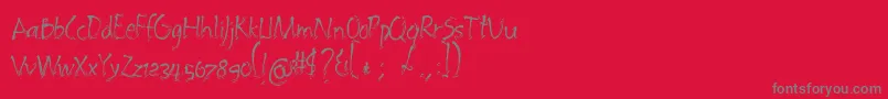 フォントEmbrush – 赤い背景に灰色の文字