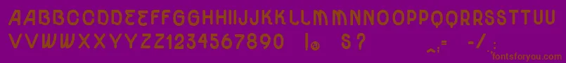 VtksUnidadeUltraBold-Schriftart – Braune Schriften auf violettem Hintergrund
