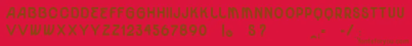 VtksUnidadeUltraBold-Schriftart – Braune Schriften auf rotem Hintergrund