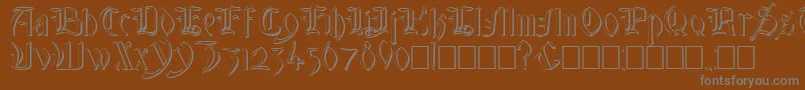 GlastonburyWideShadow Font – Gray Fonts on Brown Background