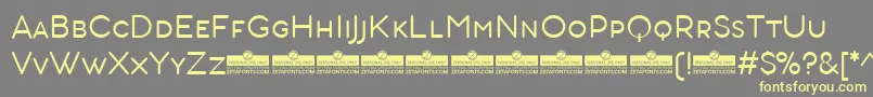 AristotelicaSmallcapsLightTrial Font – Yellow Fonts on Gray Background