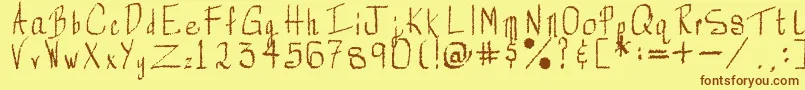 フォントRorsch – 茶色の文字が黄色の背景にあります。