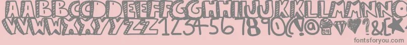 Guestservice-fontti – harmaat kirjasimet vaaleanpunaisella taustalla
