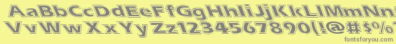 Esascolt-fontti – harmaat kirjasimet keltaisella taustalla