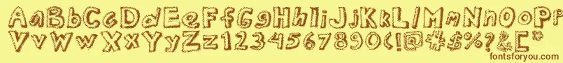 Шрифт Dottednewspaper – коричневые шрифты на жёлтом фоне