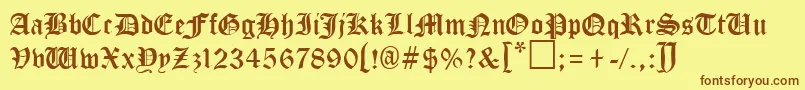 フォントTungiaRegular – 茶色の文字が黄色の背景にあります。