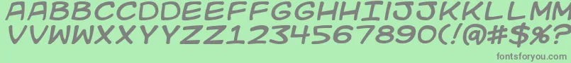 フォントKidkosmici – 緑の背景に灰色の文字