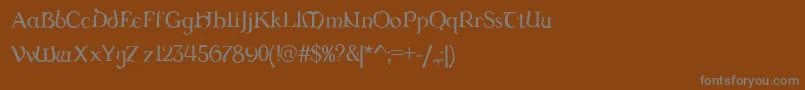 Dungrg-fontti – harmaat kirjasimet ruskealla taustalla