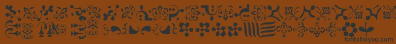 Weitere Informationen zur CaravanLhOne-Schriftart CaravanLhOne-Schriftart – Schwarze Schriften auf braunem Hintergrund