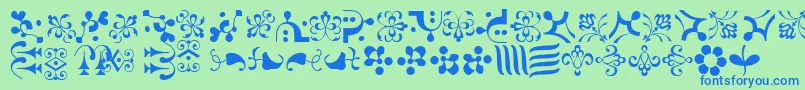 CaravanLhOne-Schriftart – Blaue Schriften auf grünem Hintergrund