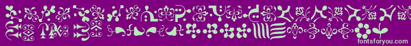 Weitere Informationen zur CaravanLhOne-Schriftart CaravanLhOne-Schriftart – Grüne Schriften auf violettem Hintergrund