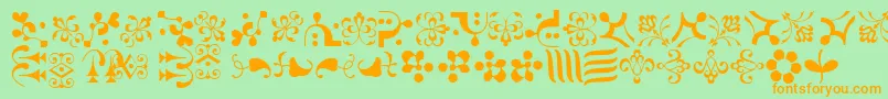 CaravanLhOne-Schriftart – Orangefarbene Schriften auf grünem Hintergrund