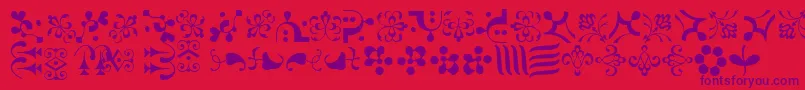 CaravanLhOne Font – Purple Fonts on Red Background