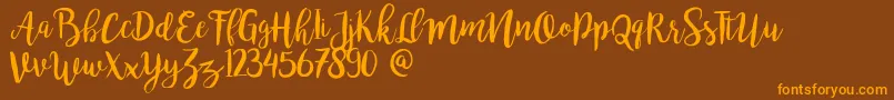 Bromello-Schriftart – Orangefarbene Schriften auf braunem Hintergrund