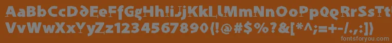 ProthesisCaribiqu-fontti – harmaat kirjasimet ruskealla taustalla