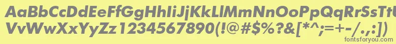FuturisttBolditalic-fontti – harmaat kirjasimet keltaisella taustalla