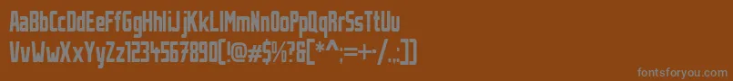 StahlbetontraegerCompressed-fontti – harmaat kirjasimet ruskealla taustalla