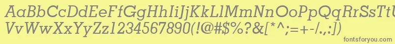 JaakSsiItalic-fontti – harmaat kirjasimet keltaisella taustalla