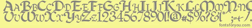 フォントQuillc – 黄色の背景に灰色の文字