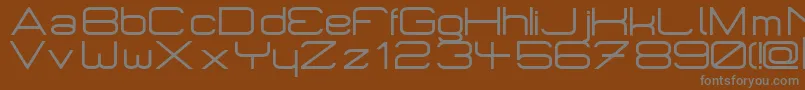 Micromieps-Schriftart – Graue Schriften auf braunem Hintergrund