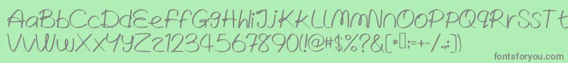 WrittenLies Font – Gray Fonts on Green Background