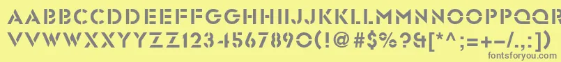 フォントGlasten – 黄色の背景に灰色の文字