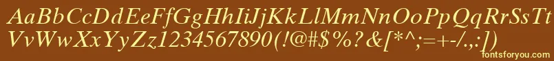 TimesTenLtItalic-fontti – keltaiset fontit ruskealla taustalla