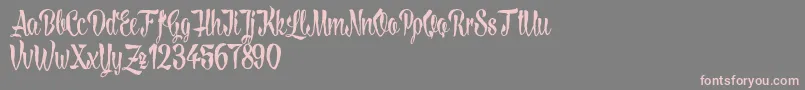 LovelymadnessDemoversion-Schriftart – Rosa Schriften auf grauem Hintergrund