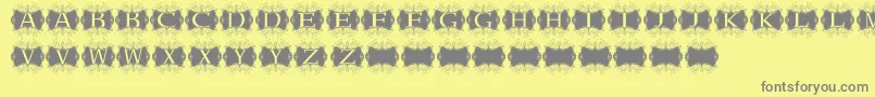 Kerawang-Schriftart – Graue Schriften auf gelbem Hintergrund