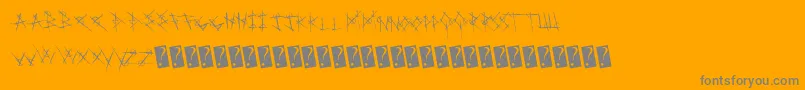 Metalchakra-fontti – harmaat kirjasimet oranssilla taustalla