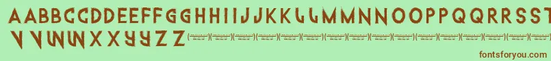 Intothegatorpit Font – Brown Fonts on Green Background