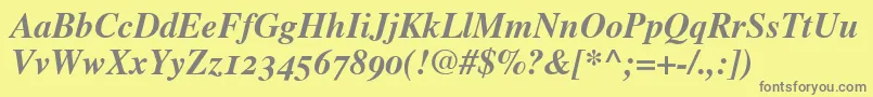 TimesBoldItalicOldStyleFigures-fontti – harmaat kirjasimet keltaisella taustalla